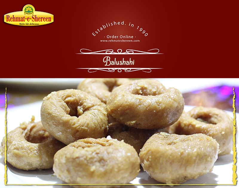 **Rehmat-e-Shereen Balushahi (1 lb)**
A classic traditional sweet with a crispy, flaky exterior and a soft, syrupy inside. Made from deep-fried dough soaked in fragrant sugar syrup, Balushahi offers a rich, melt-in-your-mouth taste loved for its authentic flavor and texture.
